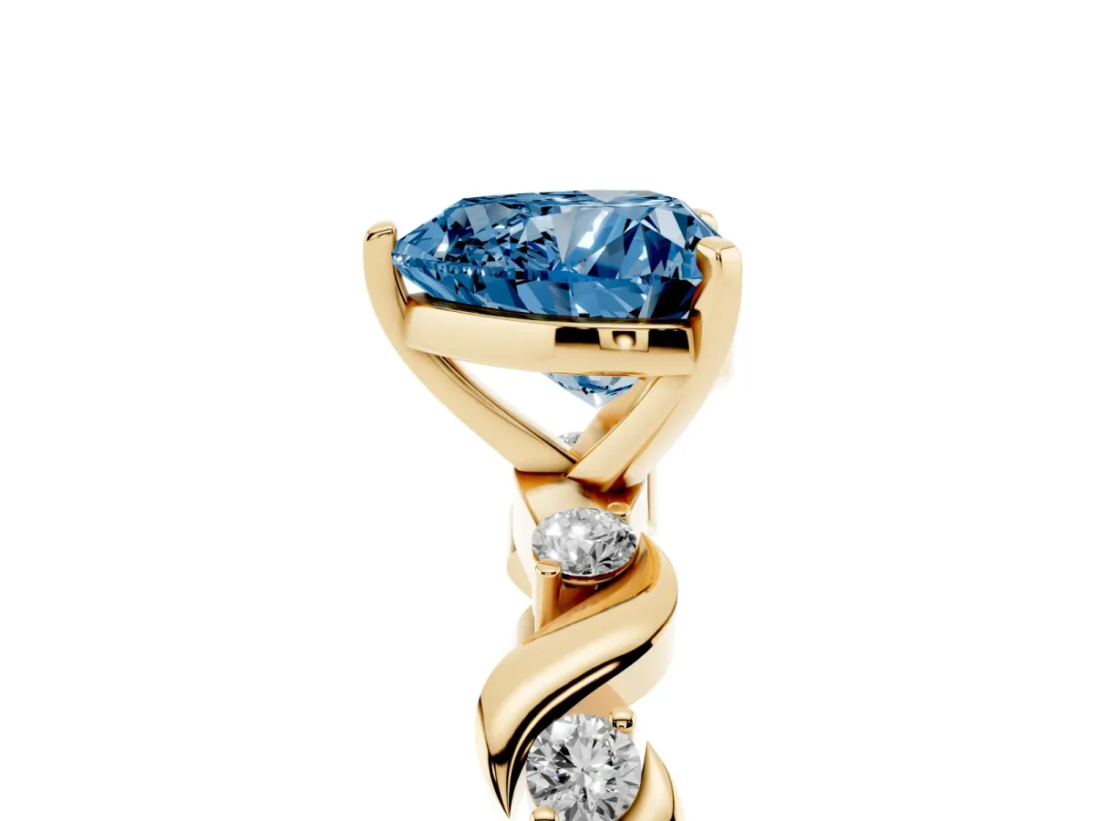 Fancy Blue Heart Cut Diamond Solitaire Twisted Band with Round Accents and Prong Setting Yellow gold