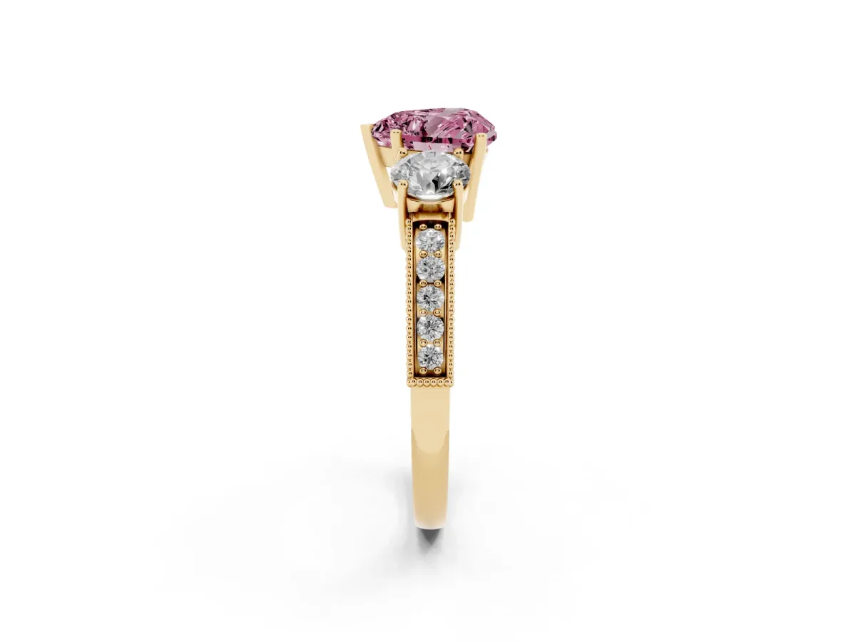 Fancy Pink Heart Cut Three-Stone Diamond Ring with Pavé Band and Four-Prong Setting Yellow gold