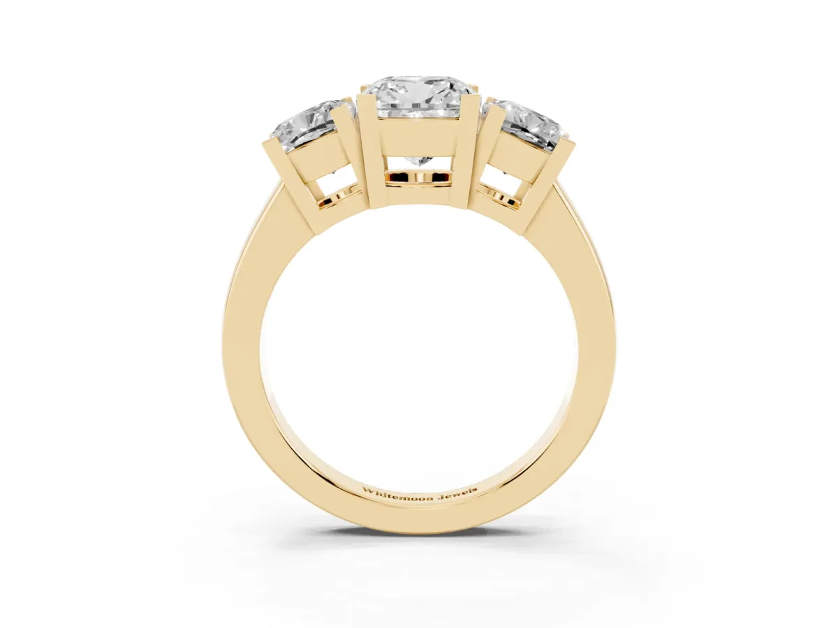 Three-Stone Cushion Cut Cut Diamond Ring with Channel Set Band and Four-Prong Setting Yellow gold