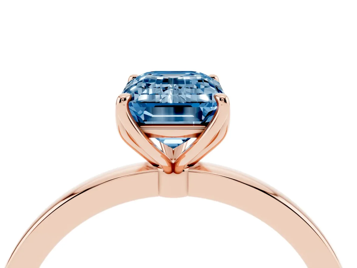 Fancy Blue Emerald Cut Diamond Solitaire Ring with Thin Band and Prong Setting Rose gold