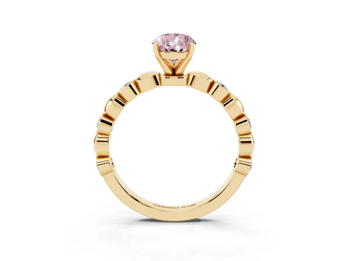 Fancy Pink Pear Cut Solitaire Bezel-Set Diamond Ring with Beaded Band and Four-Prong Setting Yellow gold