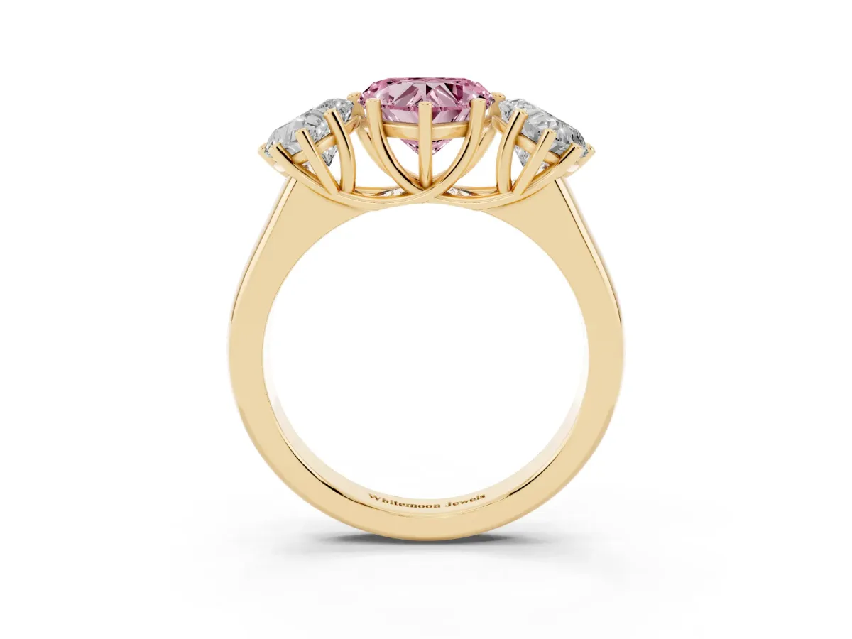 Fancy Pink Heart Cut Three-Stone Diamond Ring with Prong Setting on a Classic Band Yellow gold