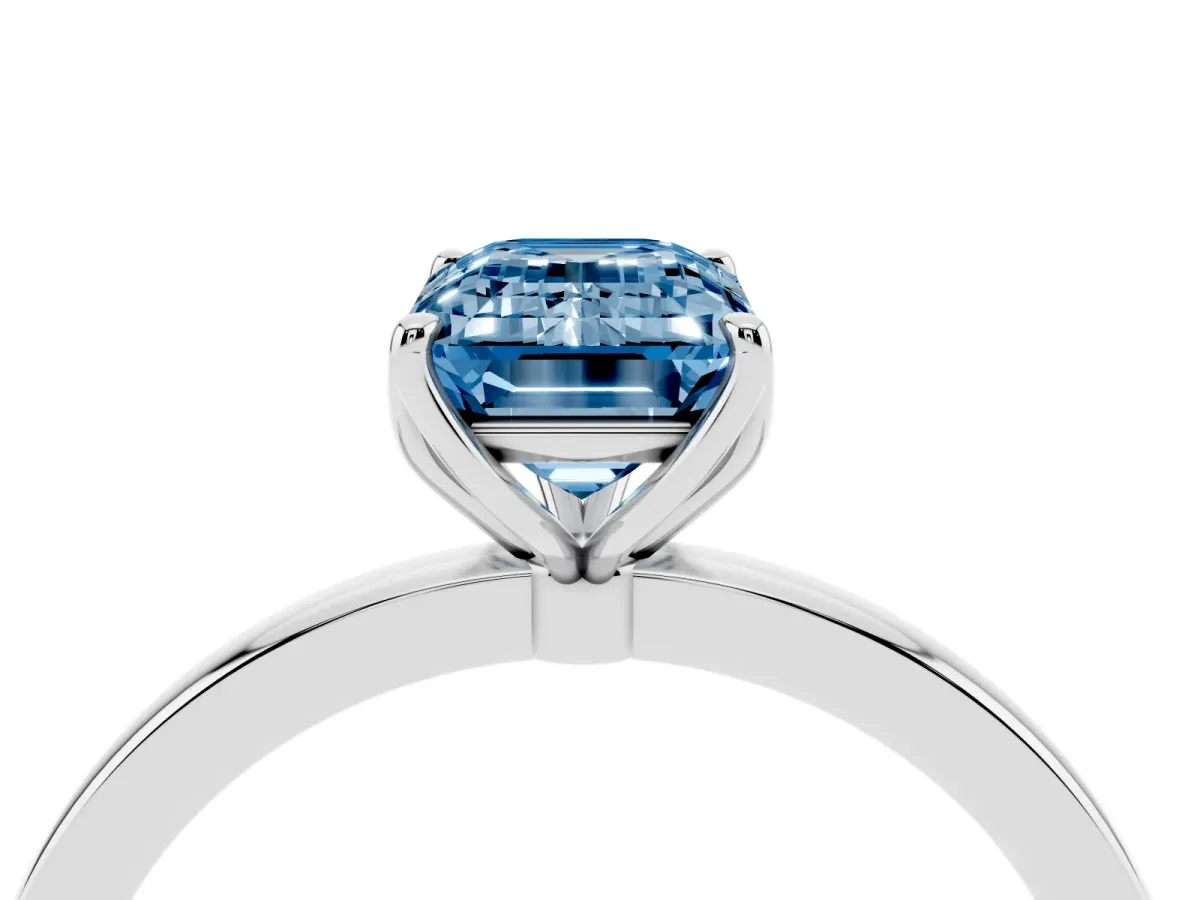 Fancy Blue Emerald Cut Diamond Solitaire Ring with Thin Band and Prong Setting Silver