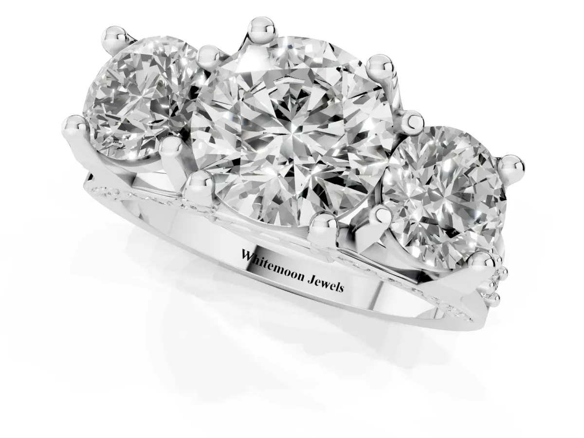 Round Cut Diamond Three-Stone Ring with Channel Set Band and Four-Prong Setting Silver