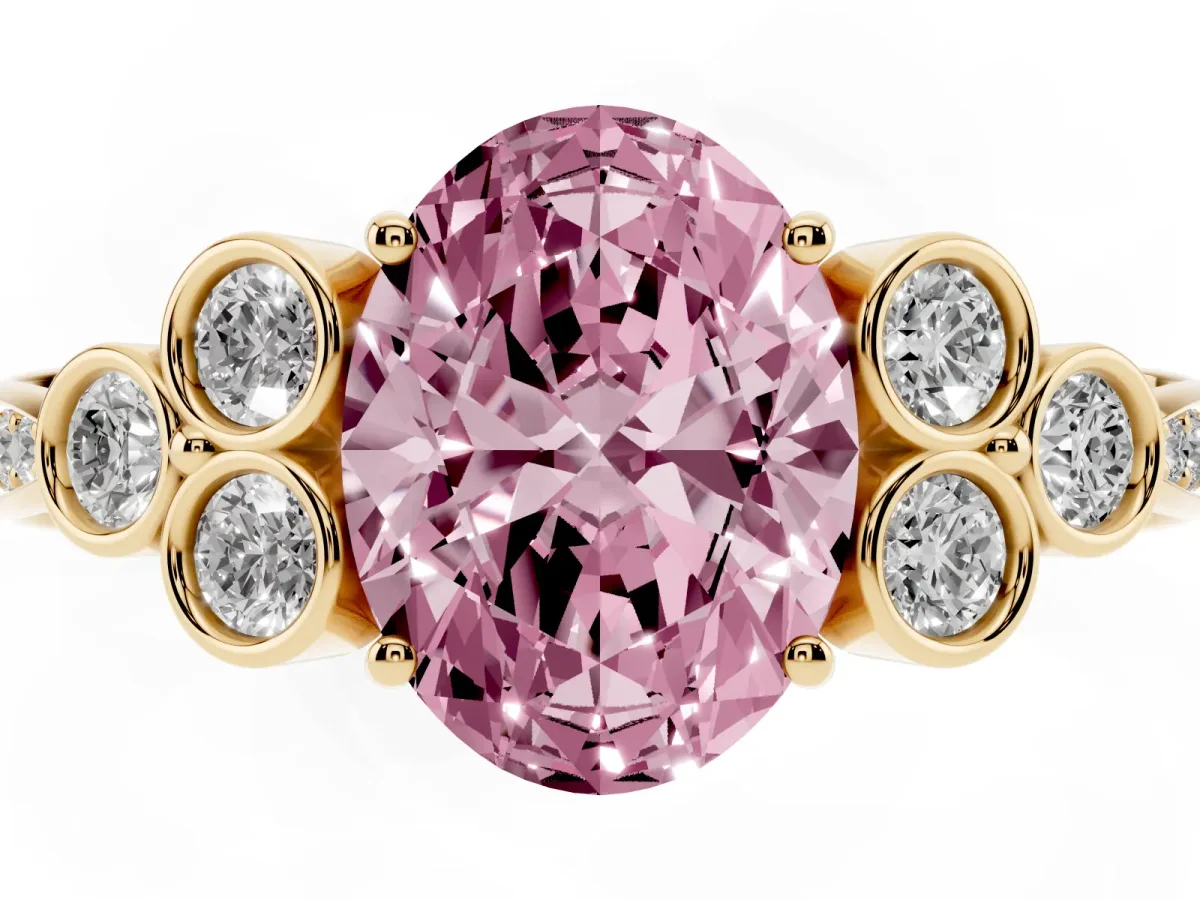Fancy Pink Oval Cut Cut Diamond Engagement Ring with Bezel Set Round Side Stones and Prong Setting Yellow gold