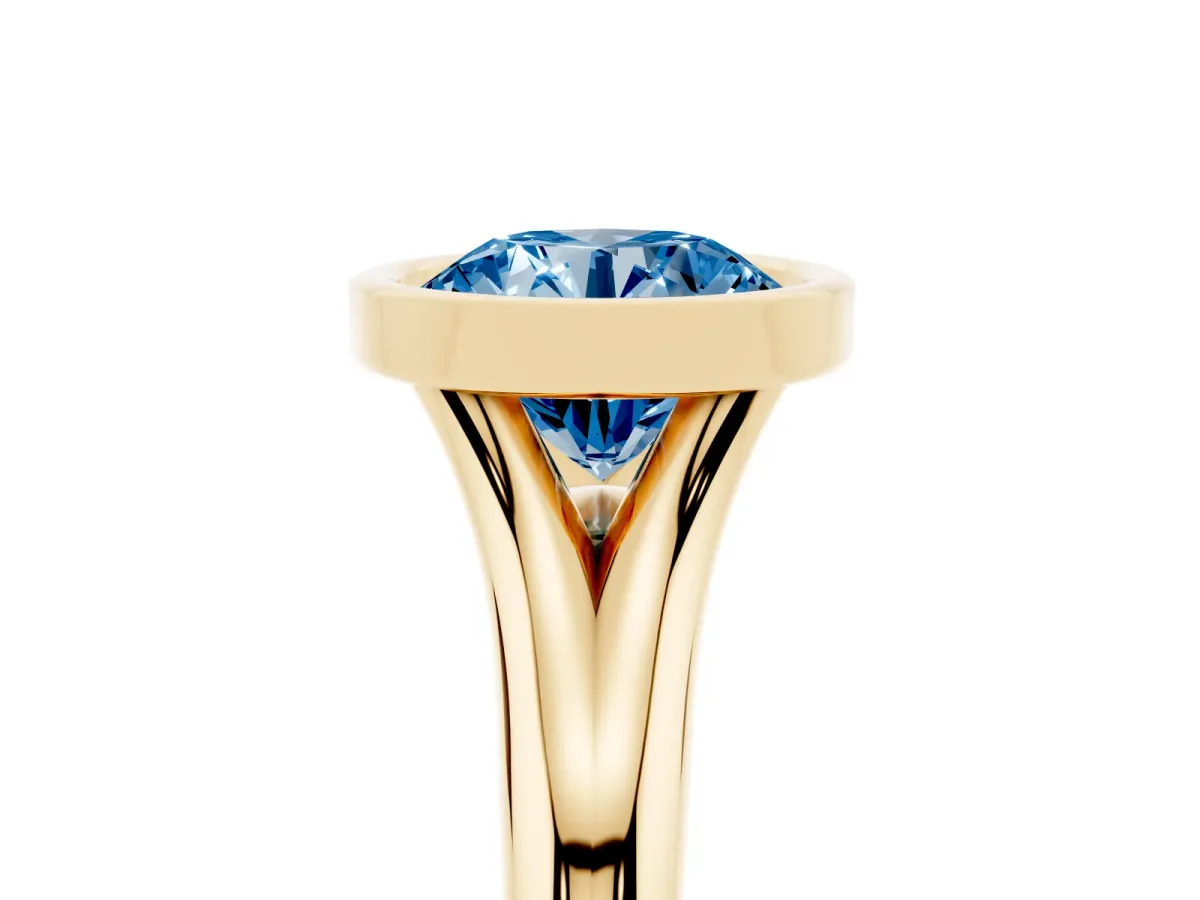Fancy Blue Bezel Set Round Cut Solitaire Diamond Ring with Smooth Band Yellow gold