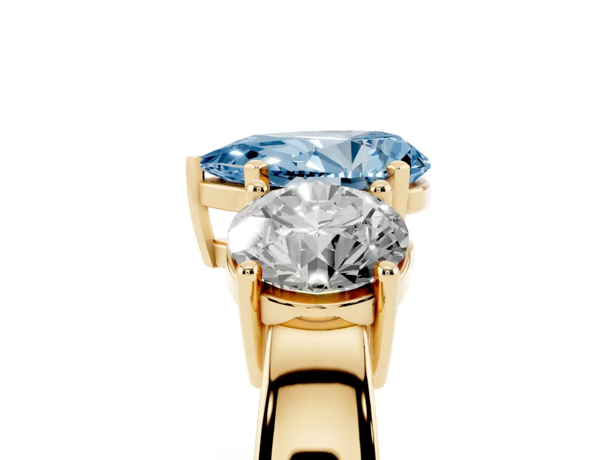 Fancy Blue Three-Stone Pear Cut Diamond Ring with Round Side Stones, Classic Band, and Four-Prong Setting Yellow gold