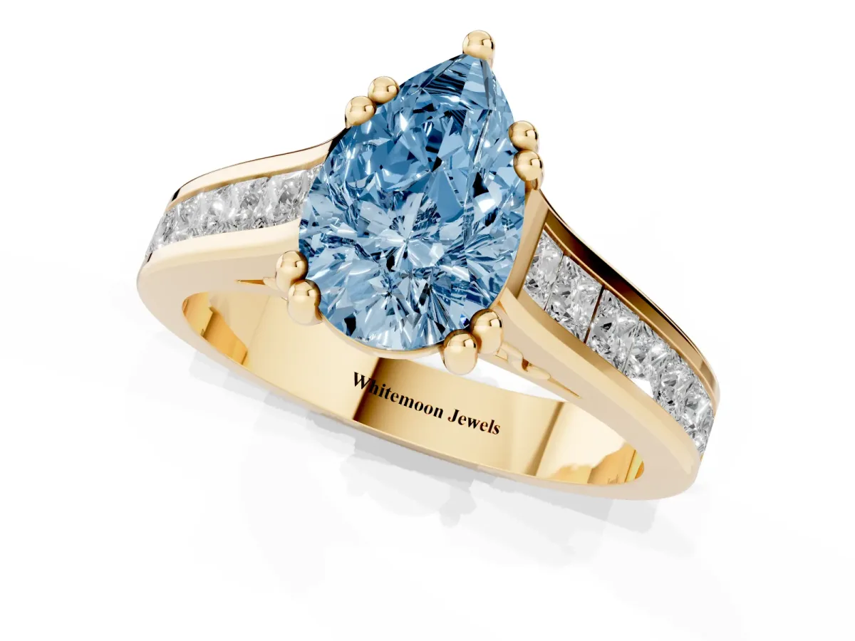 Fancy Blue Pear Cut Cut Channel Set Solitaire Engagement Ring with Prong Setting Yellow gold