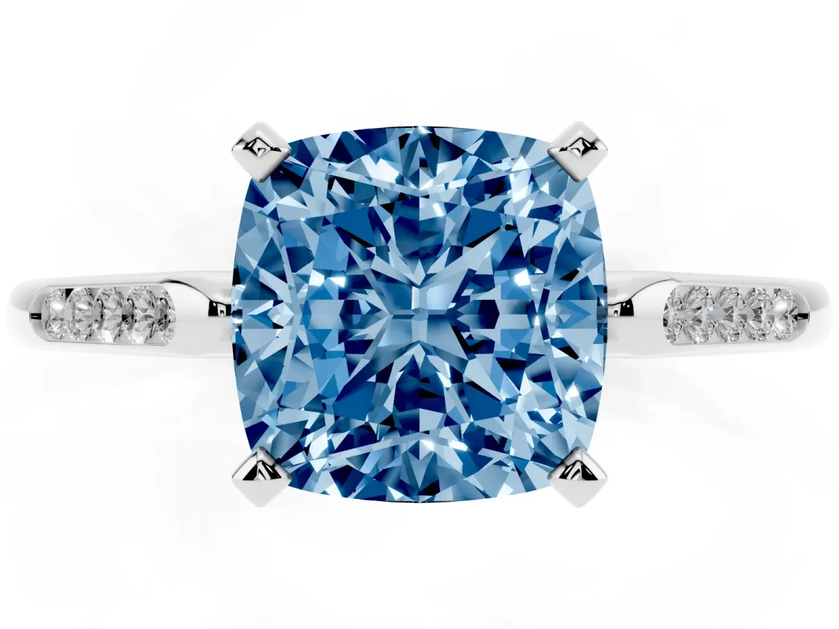 Fancy Blue Cushion Cut Diamond Solitaire Ring with Channel Set Round Band and Prong Setting Silver