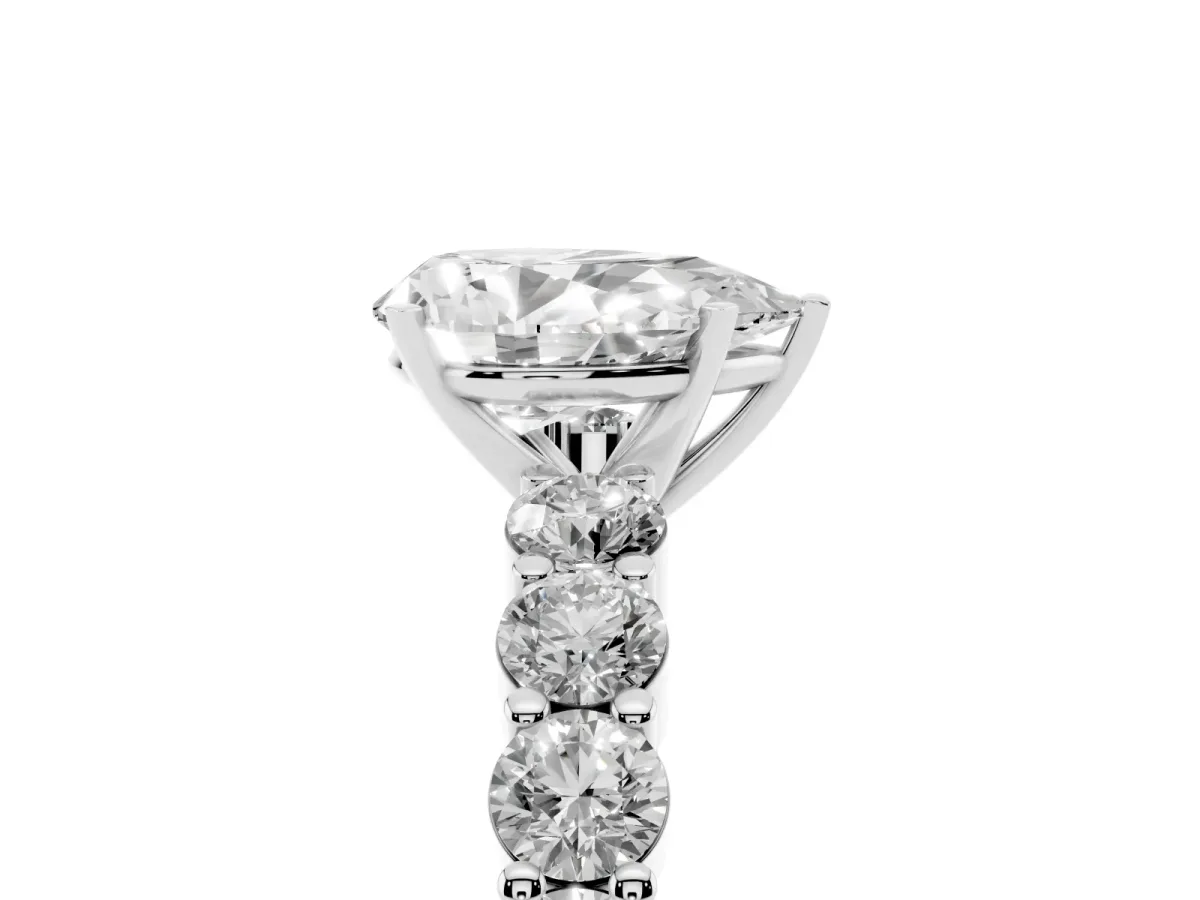 Pear Cut Diamond Solitaire Ring with Shared Prong Round Side Stones White gold