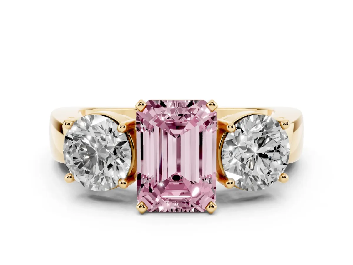 Fancy Pink Three-Stone Emerald Cut Diamond Ring with Round Side Stones, Classic Band, and Four-Prong Setting Yellow gold