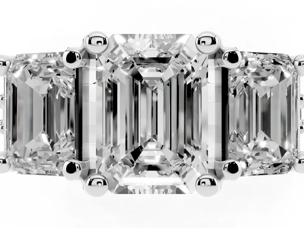 Emerald Cut Diamond Three-Stone Ring with Channel Set Band and Four-Prong Setting Silver