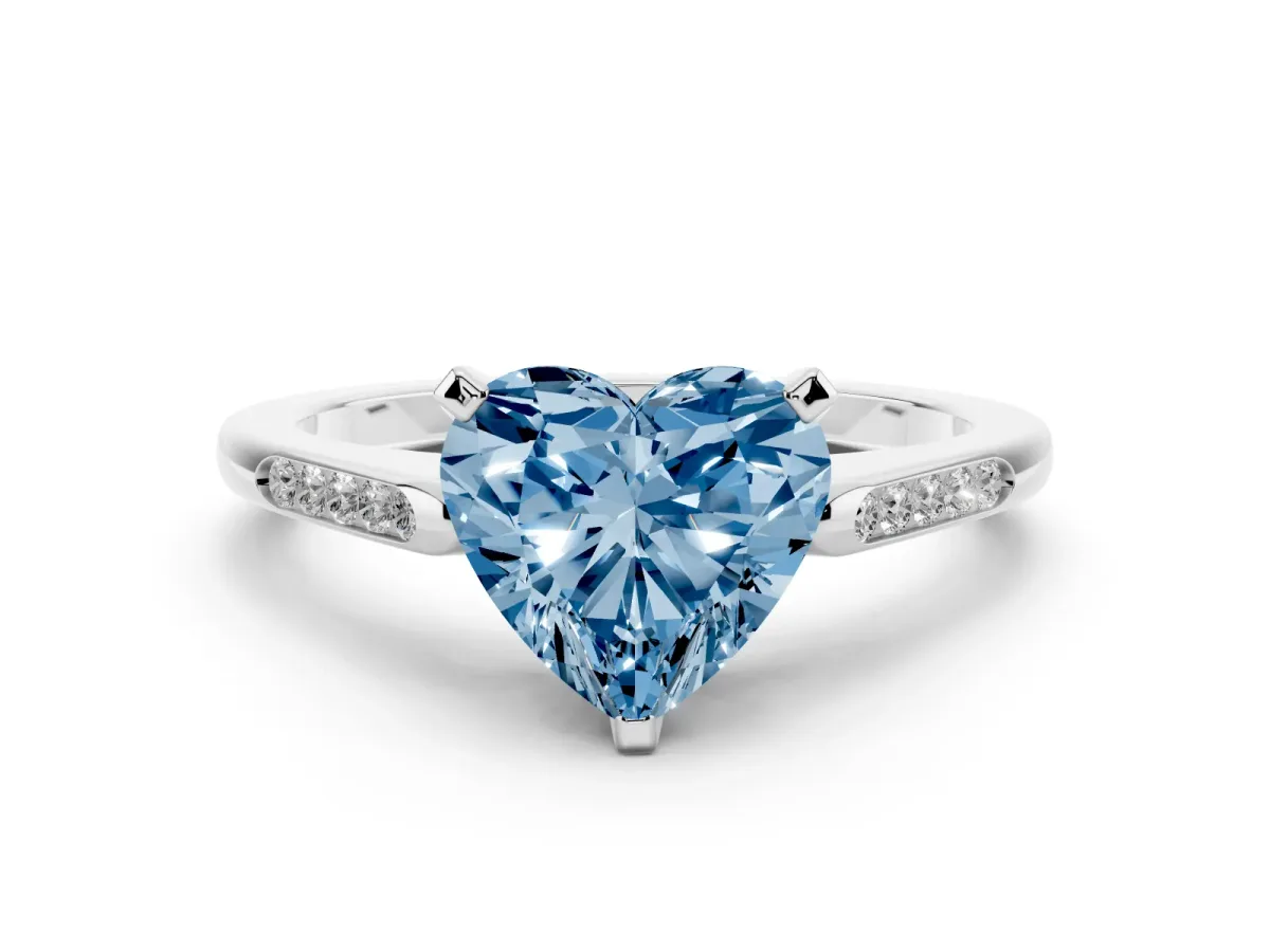 Fancy Blue Heart Cut Diamond Solitaire Ring with Channel Set Round Band and Prong Setting Silver