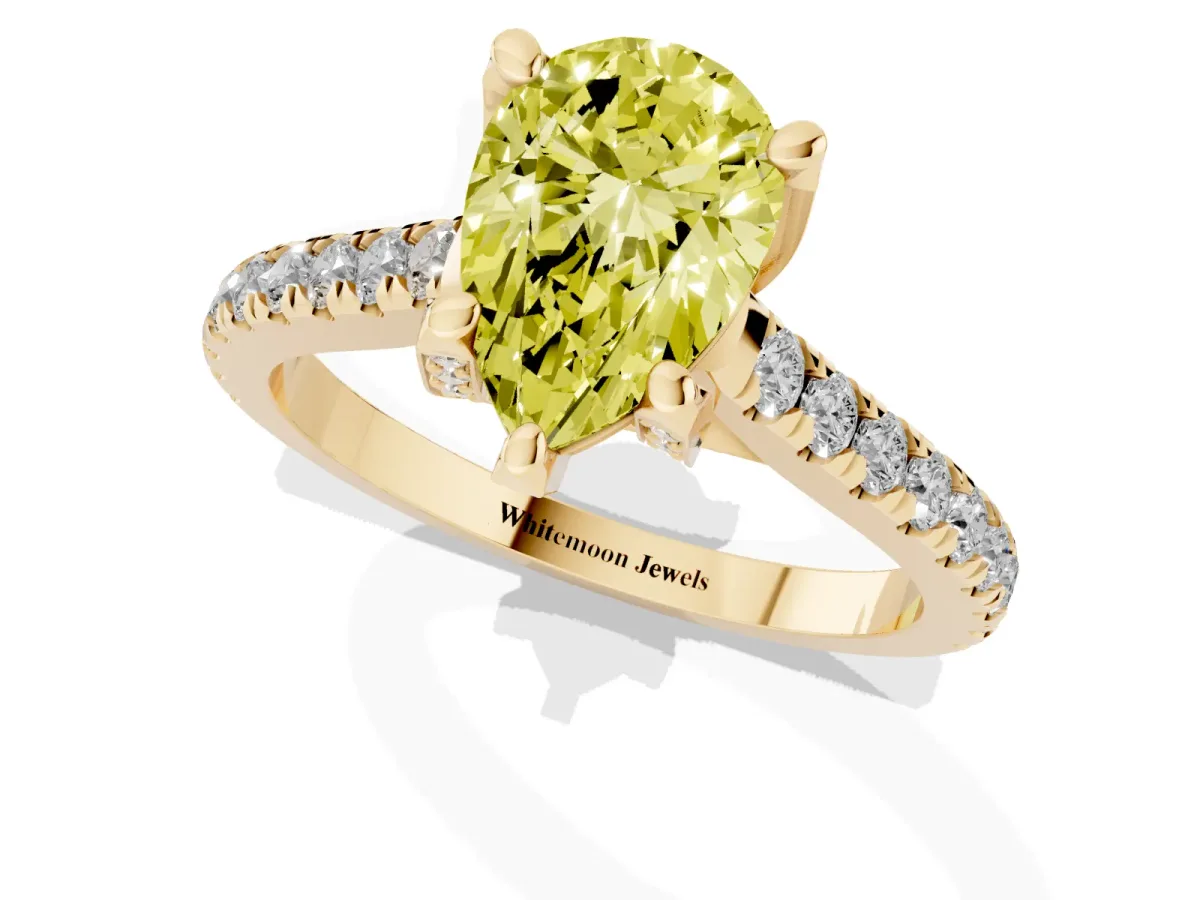 Fancy Yellow Pear Cut Brilliant Diamond Solitaire with Pavé Band and Four-Prong Setting Yellow gold
