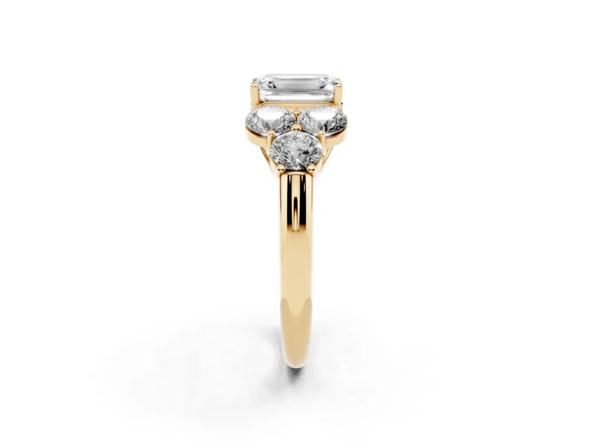 Emerald Cut Cut Diamond Cluster Ring with Round Accent Stones and Prong Setting on a Classic Band Yellow gold