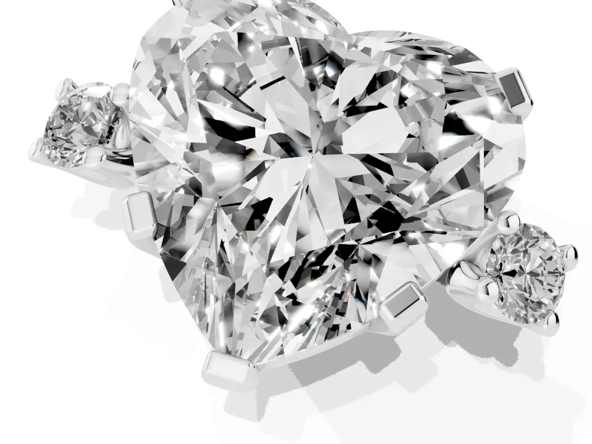Heart Cut Cut Three-Stone Solitaire Ring with Round Accent Diamonds and Four-Prong Setting Silver
