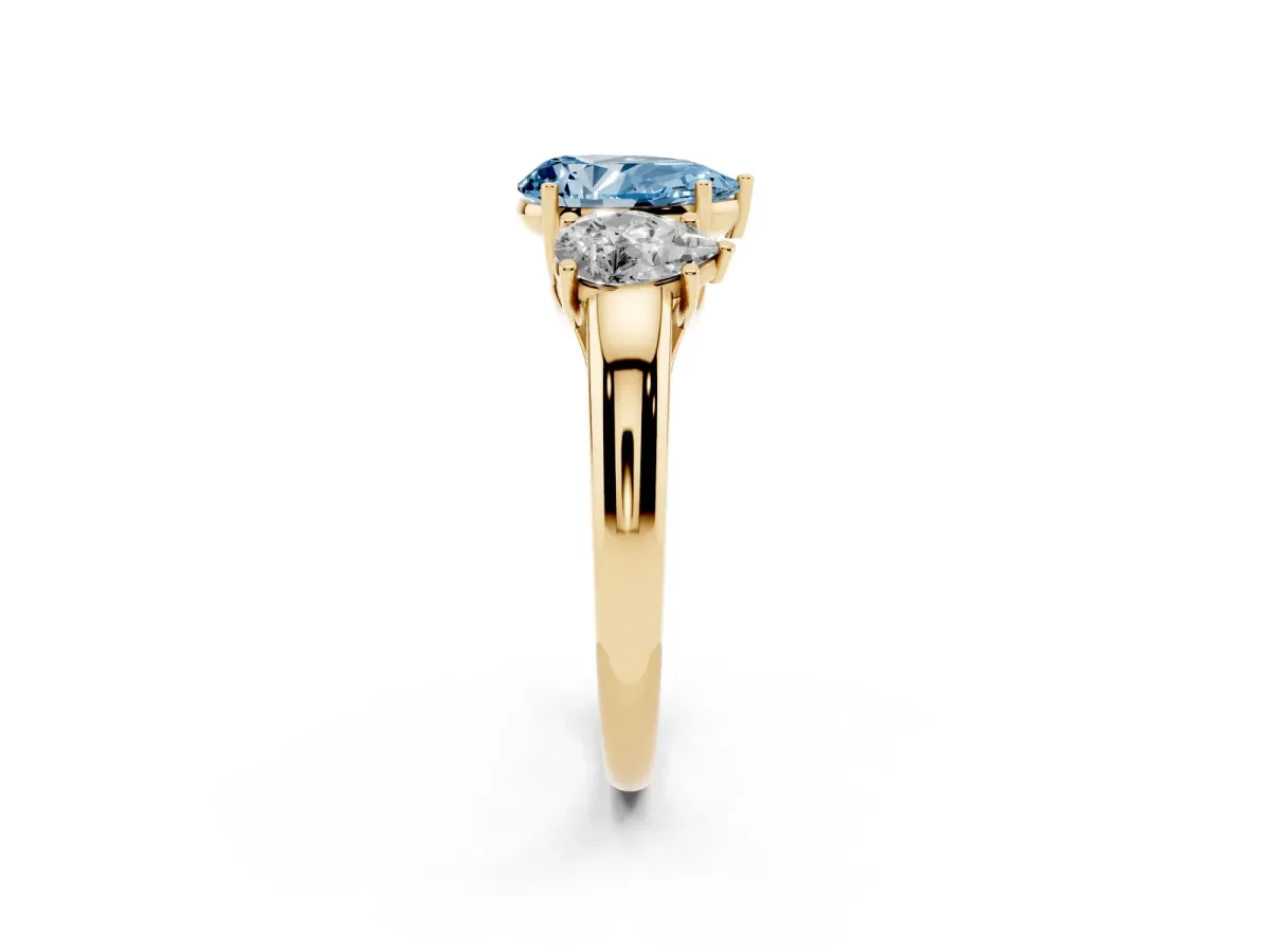 Fancy Blue Three-Stone Pear Cut Diamond Engagement Ring with Prong Setting Yellow gold