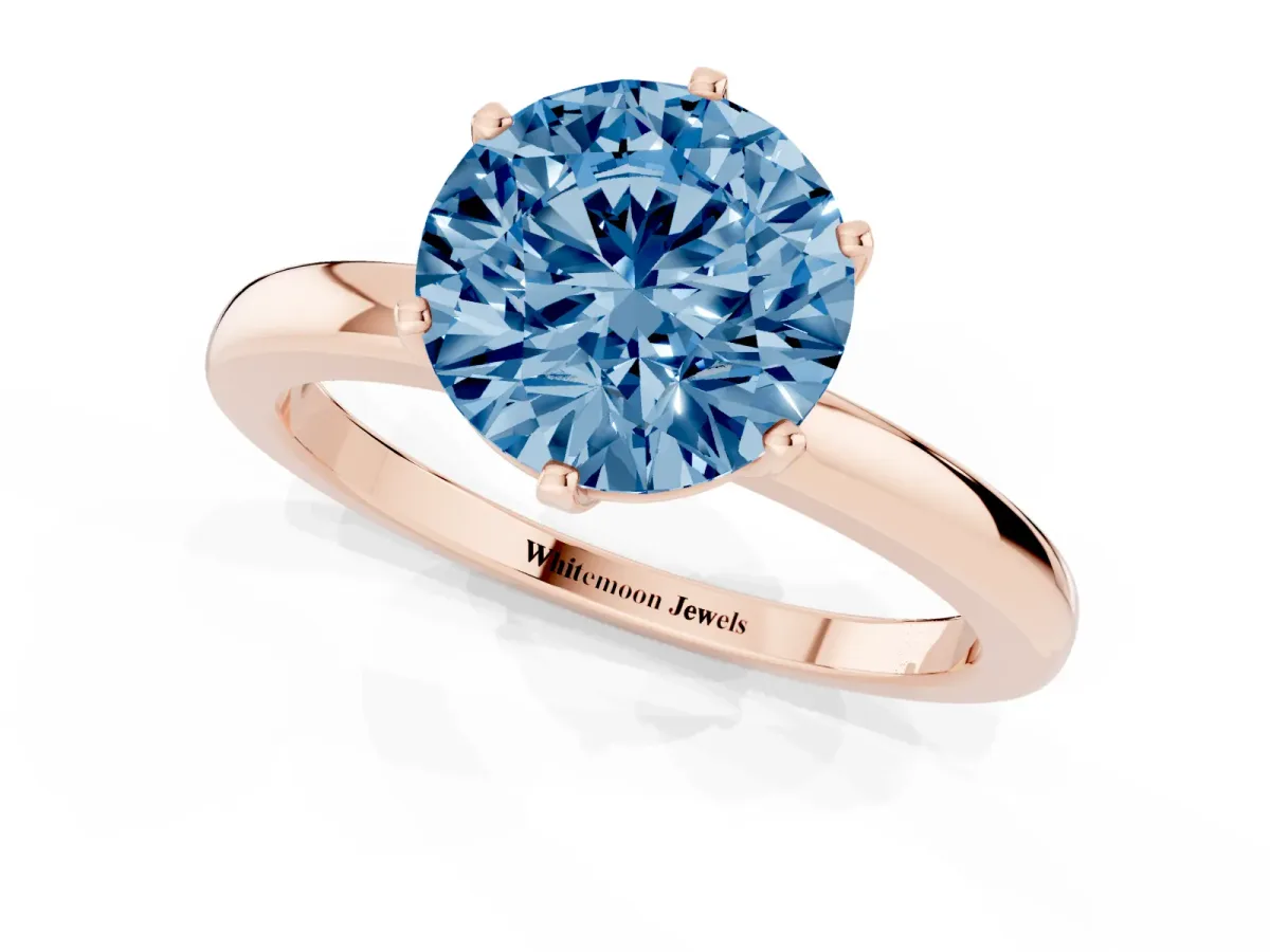 Fancy Blue Round Cut Solitaire Diamond Ring with Six-Prong Setting on a Classic Band Rose gold