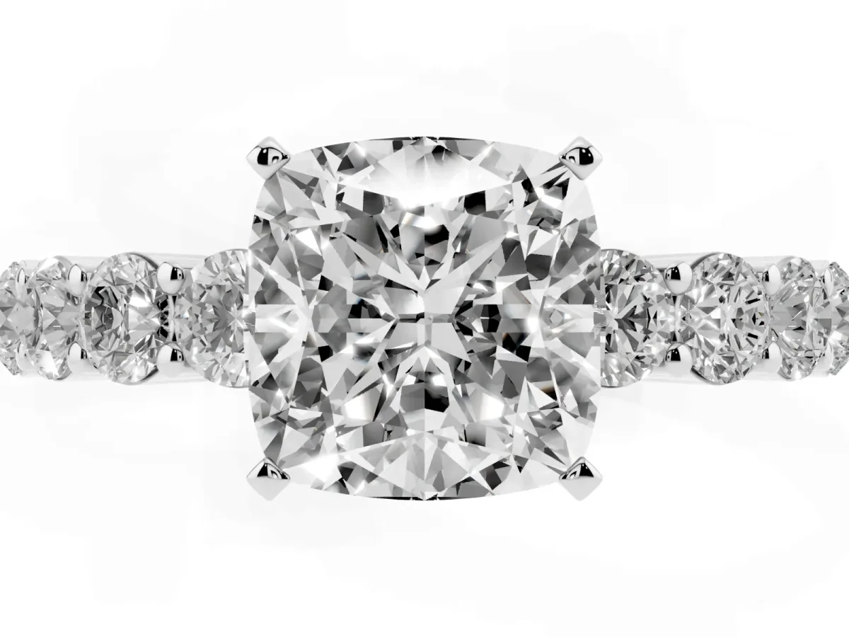 Cushion Cut Diamond Solitaire Ring with Shared Prong Round Side Stones Platinum