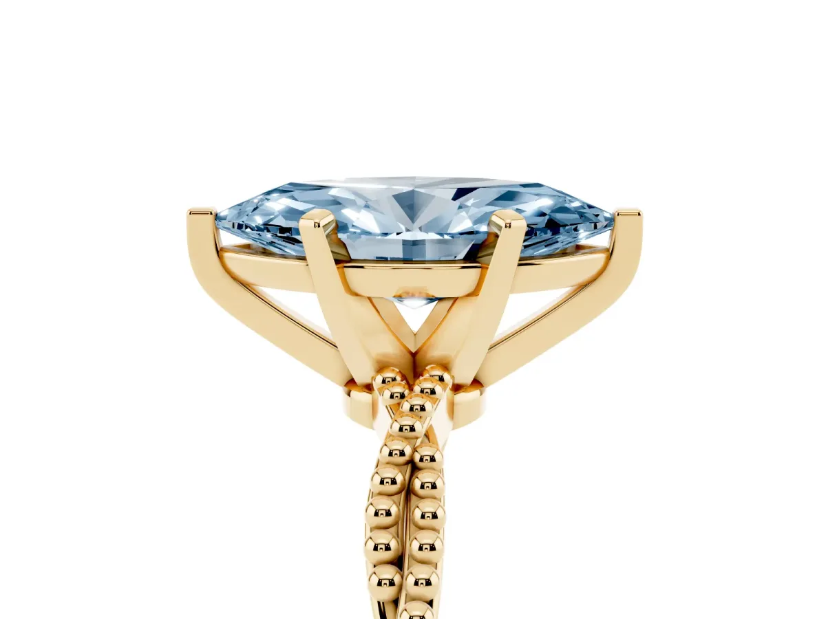Fancy Blue Marquise Cut Solitaire Twisted Band with Bead Prong Setting Yellow gold