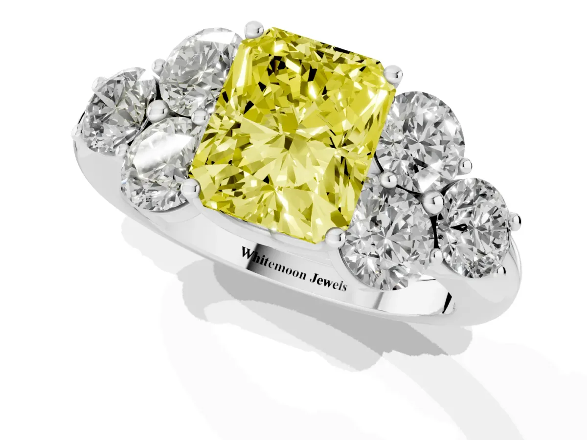 Fancy Yellow Radiant Cut Cut Diamond Cluster Ring with Round Accent Stones and Prong Setting on a Classic Band Platinum