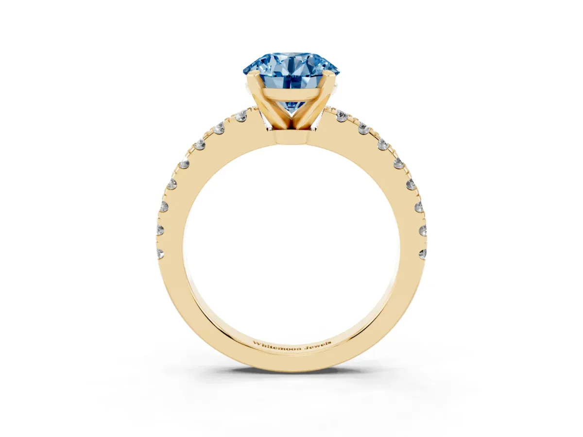 Fancy Blue Round Cut Solitaire Diamond with Pavé Band and Four-Prong Setting Yellow gold