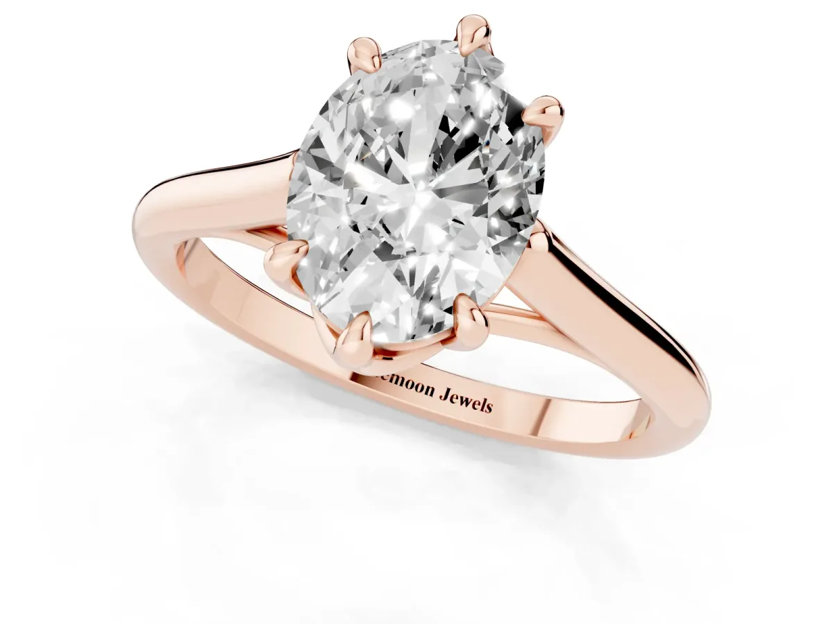 Oval Cut Solitaire Engagement Ring with Six-Prong Setting and Classic Band Rose gold