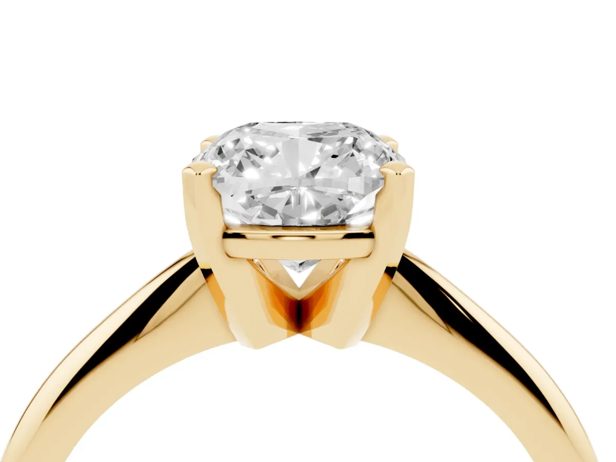 Cushion Cut Cut Solitaire Ring with Four-Prong Setting on a Classic Band Yellow gold