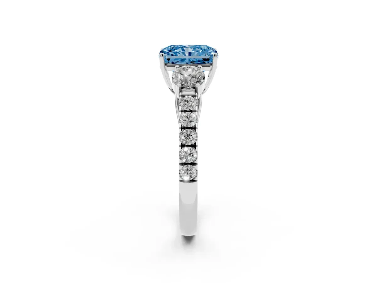 Fancy Blue Radiant Cut Cut Diamond Three-Stone Ring with Round Side Stones and Pavé Band White gold
