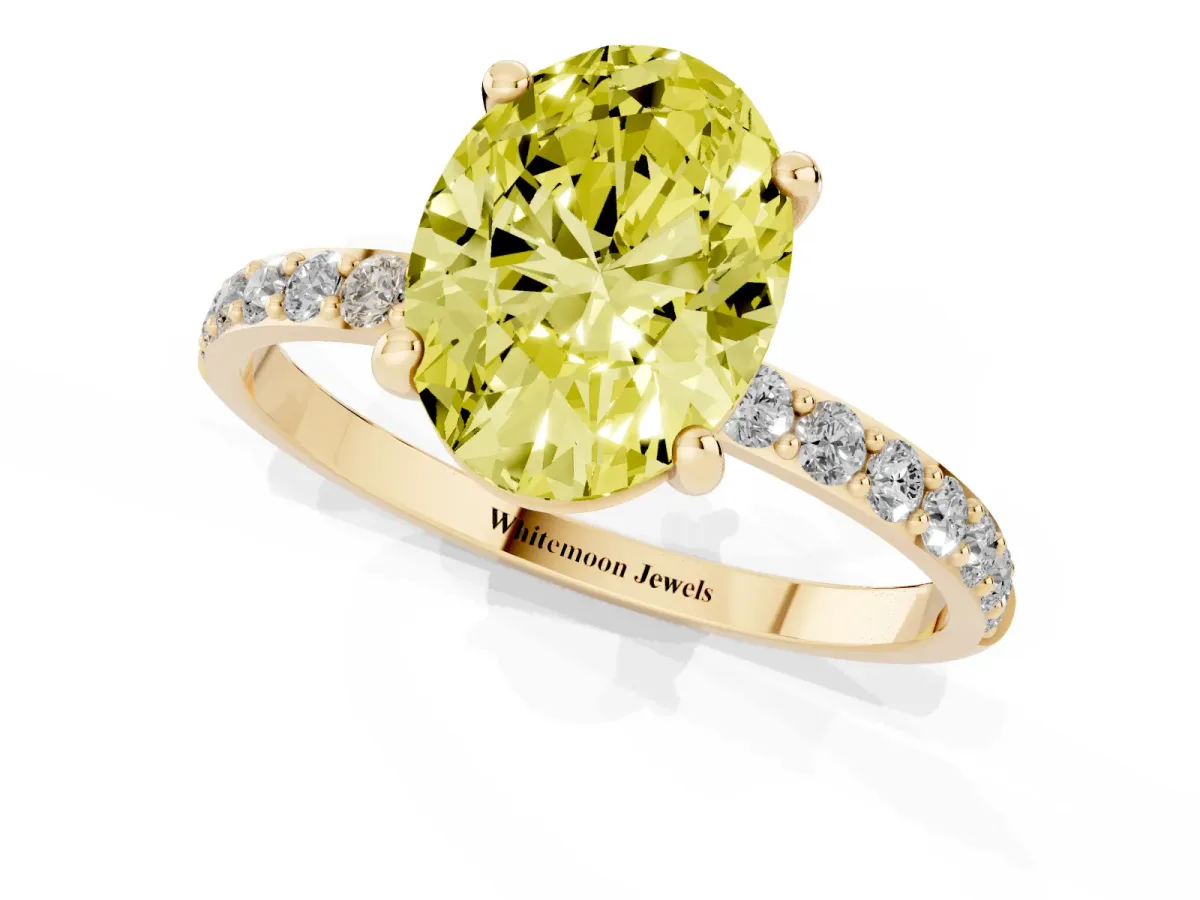 Fancy Yellow Oval Cut Diamond Solitaire Ring with Round Pavé Band and Prong Setting Yellow gold