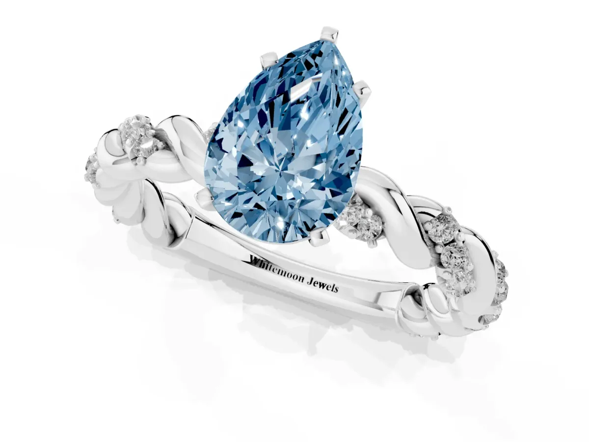 Fancy Blue Pear Cut Diamond Solitaire Ring with Twisted Band and Pavé Accents Silver