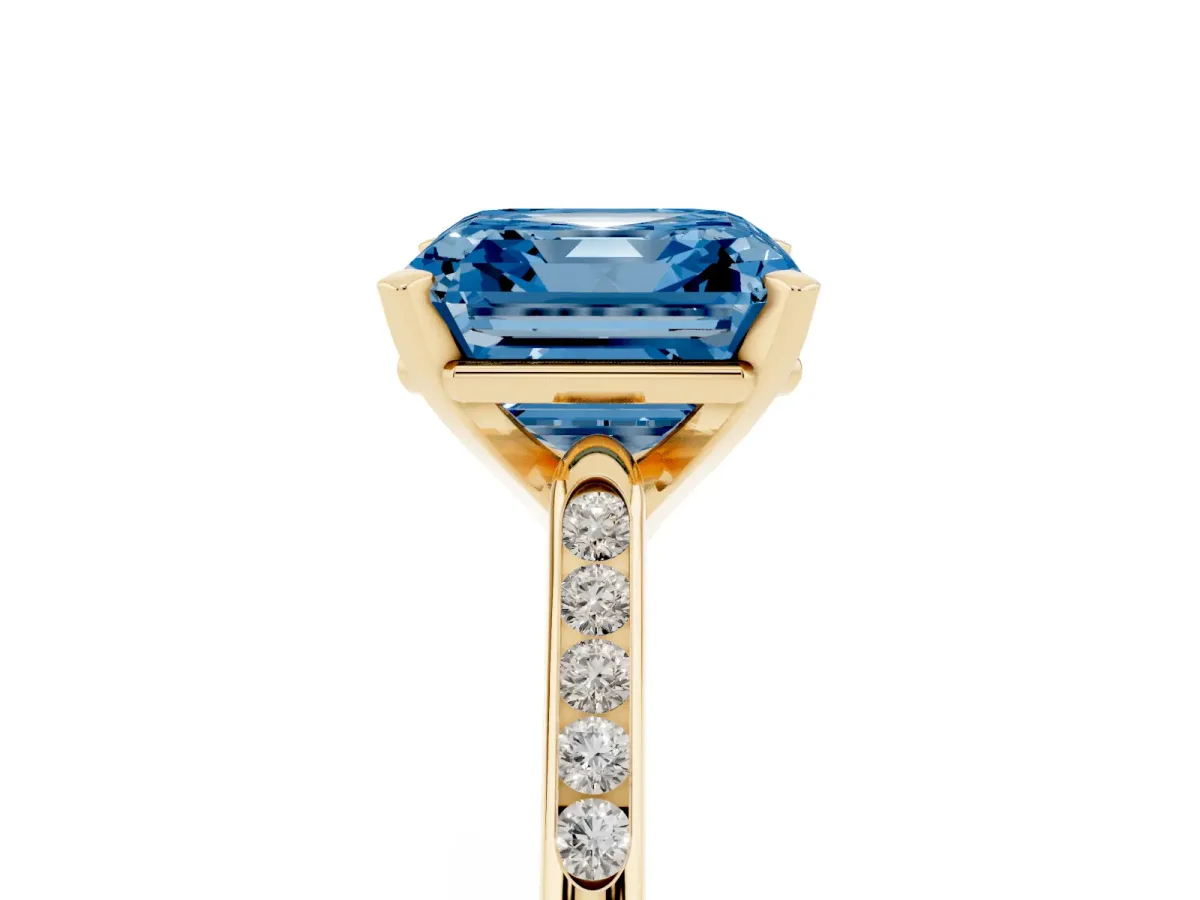 Fancy Blue Asscher Cut Diamond Solitaire Ring with Channel Set Round Band and Prong Setting Yellow gold