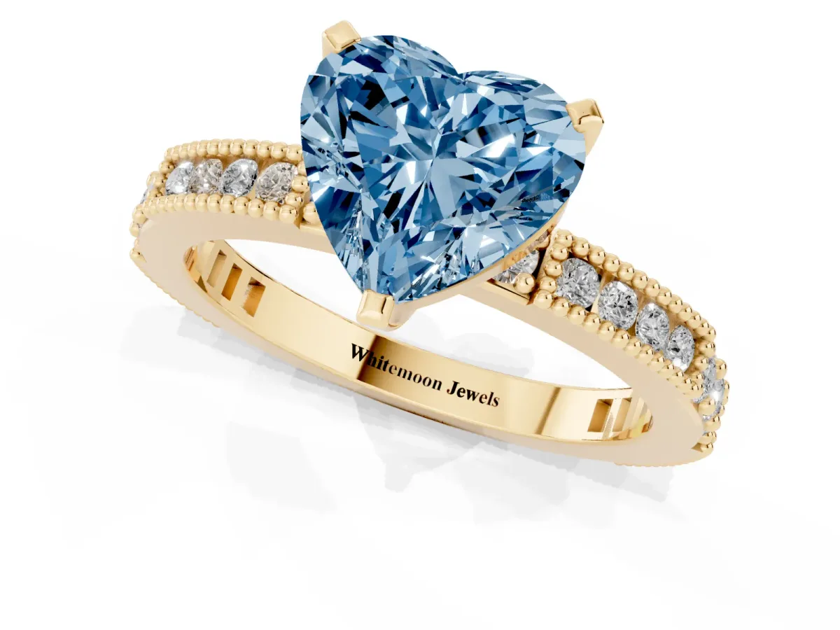 Fancy Blue Heart Cut Solitaire with Pavé Band and Four-Prong Setting Yellow gold