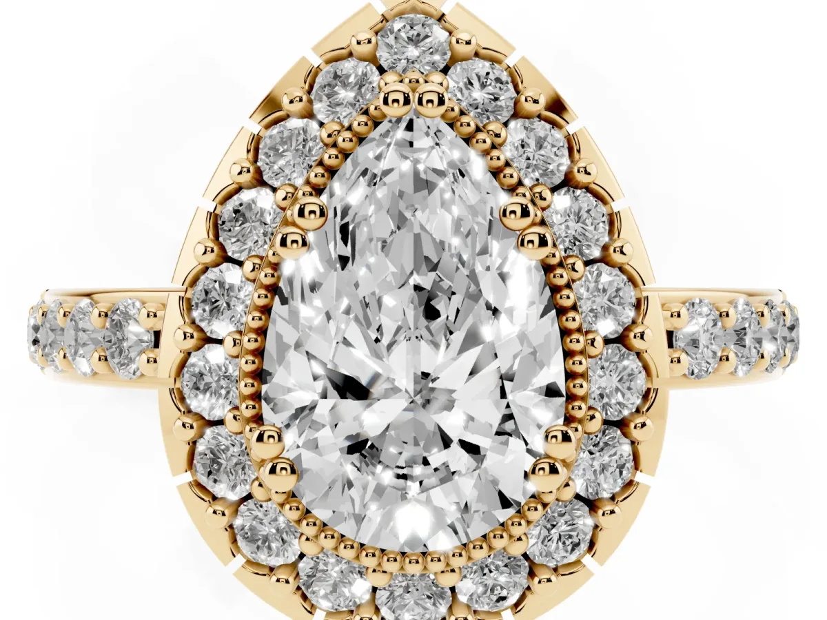 Pear Cut Diamond Halo Ring with Pavé Band and Prong Setting Yellow gold