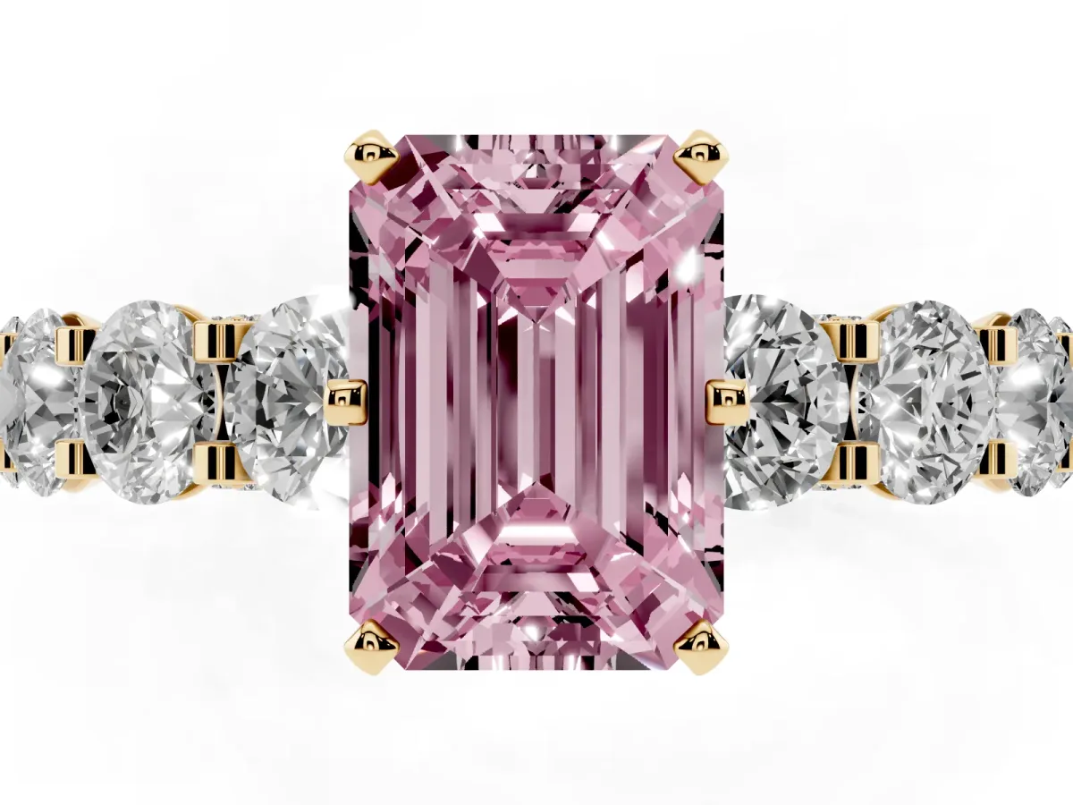 Fancy Pink Emerald Cut Diamond Side Stone Engagement Ring with Four-Prong Setting Yellow gold