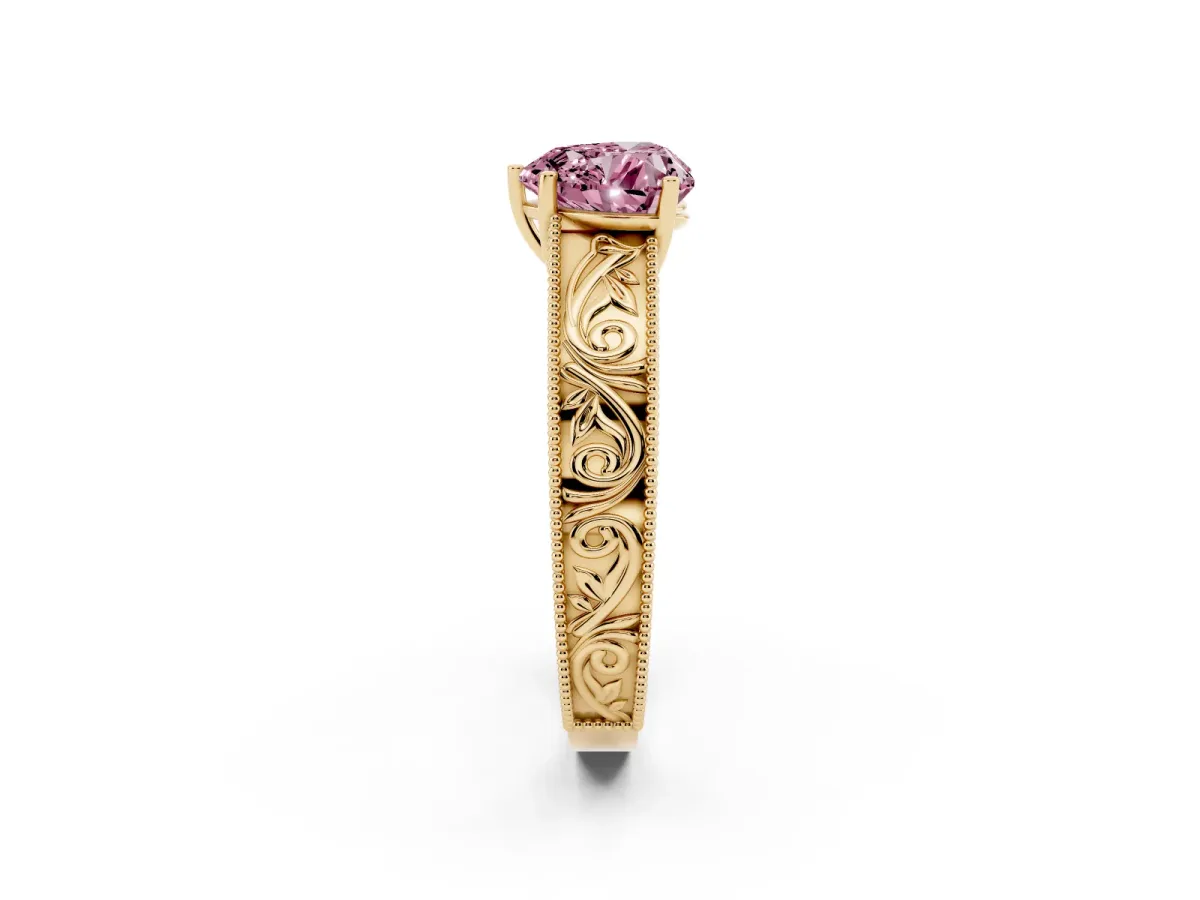 Fancy Pink Heart Cut Diamond Solitaire Ring with Engraved Band and Four-Prong Setting Yellow gold