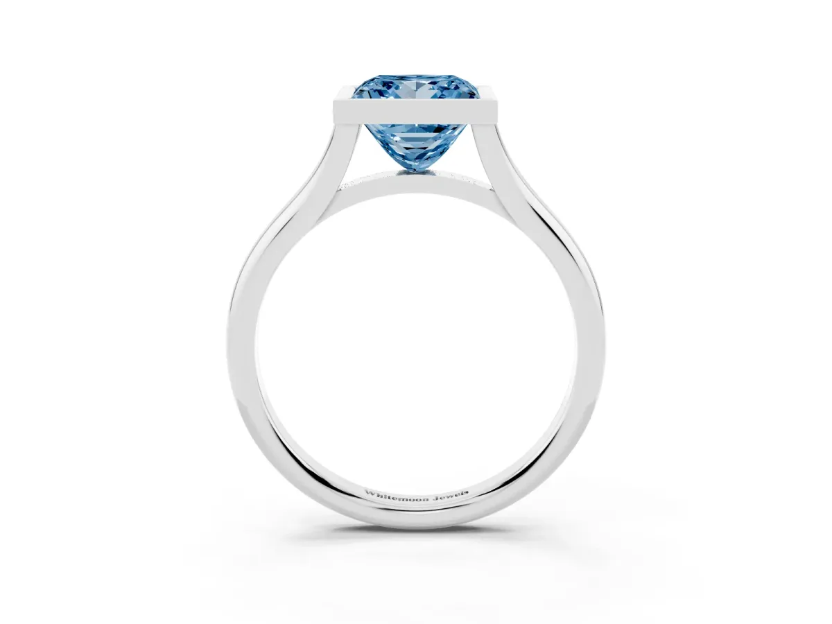 Fancy Blue Bezel Set Princess Cut Cut Solitaire Ring with Tapered Band Silver