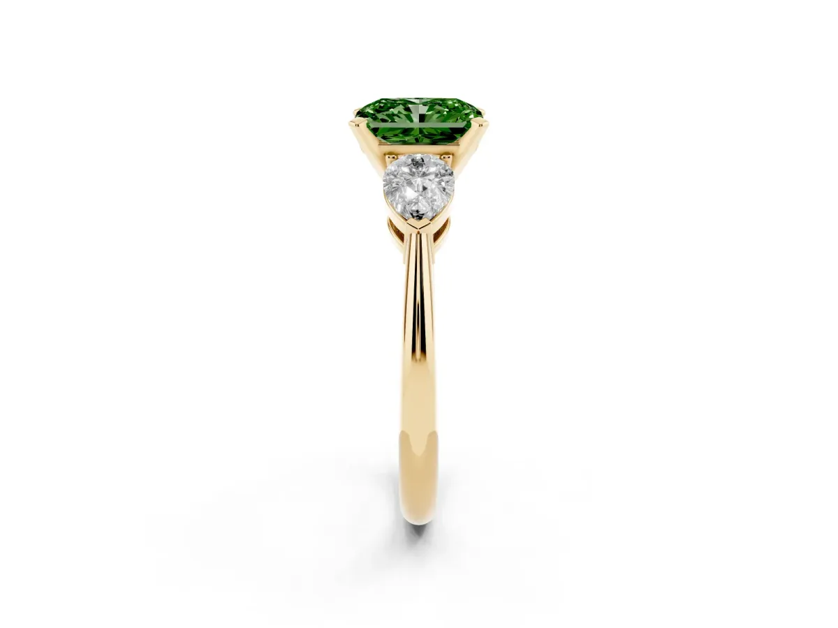 Fancy Green Three-Stone Radiant Cut Diamond Ring with Pear Side Stones and Four-Prong Setting Yellow gold