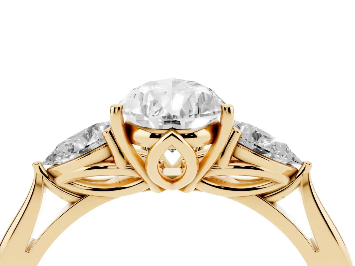 Three-Stone Pear Cut Brilliant Diamond Solitaire Ring with Tapered Band and Four-Prong Setting Yellow gold