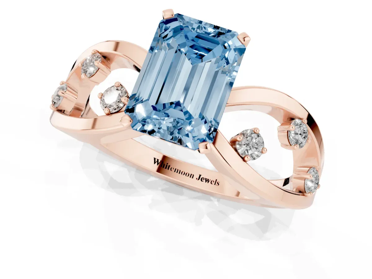 Fancy Blue Emerald Cut Cut Solitaire Diamond with Side Stones on Criss-Cross Band and Four-Prong Setting Rose gold