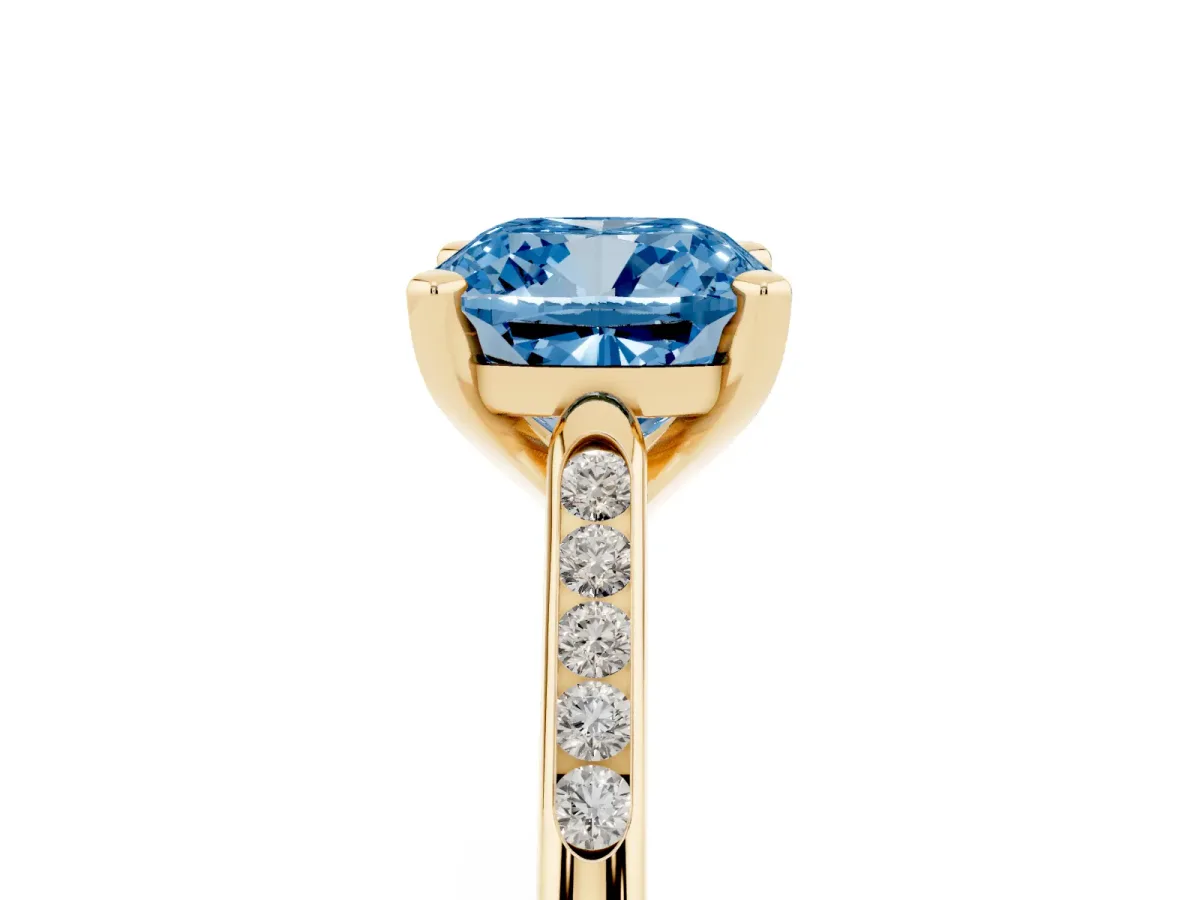 Fancy Blue Cushion Cut Diamond Solitaire Ring with Channel Set Round Band and Prong Setting Yellow gold