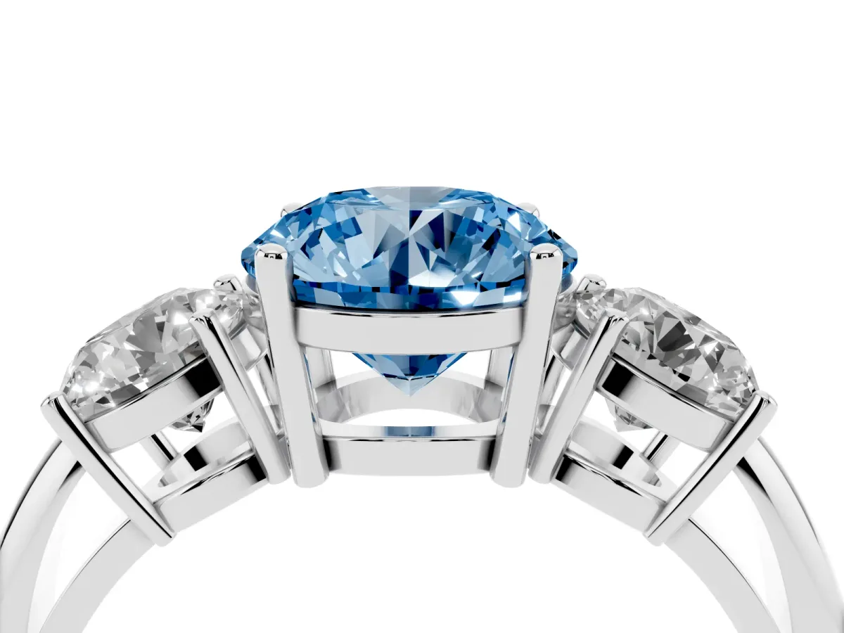 Fancy Blue Three-Stone Round Cut Cut Diamond Engagement Ring with Prong Setting on a White Gold Band Platinum
