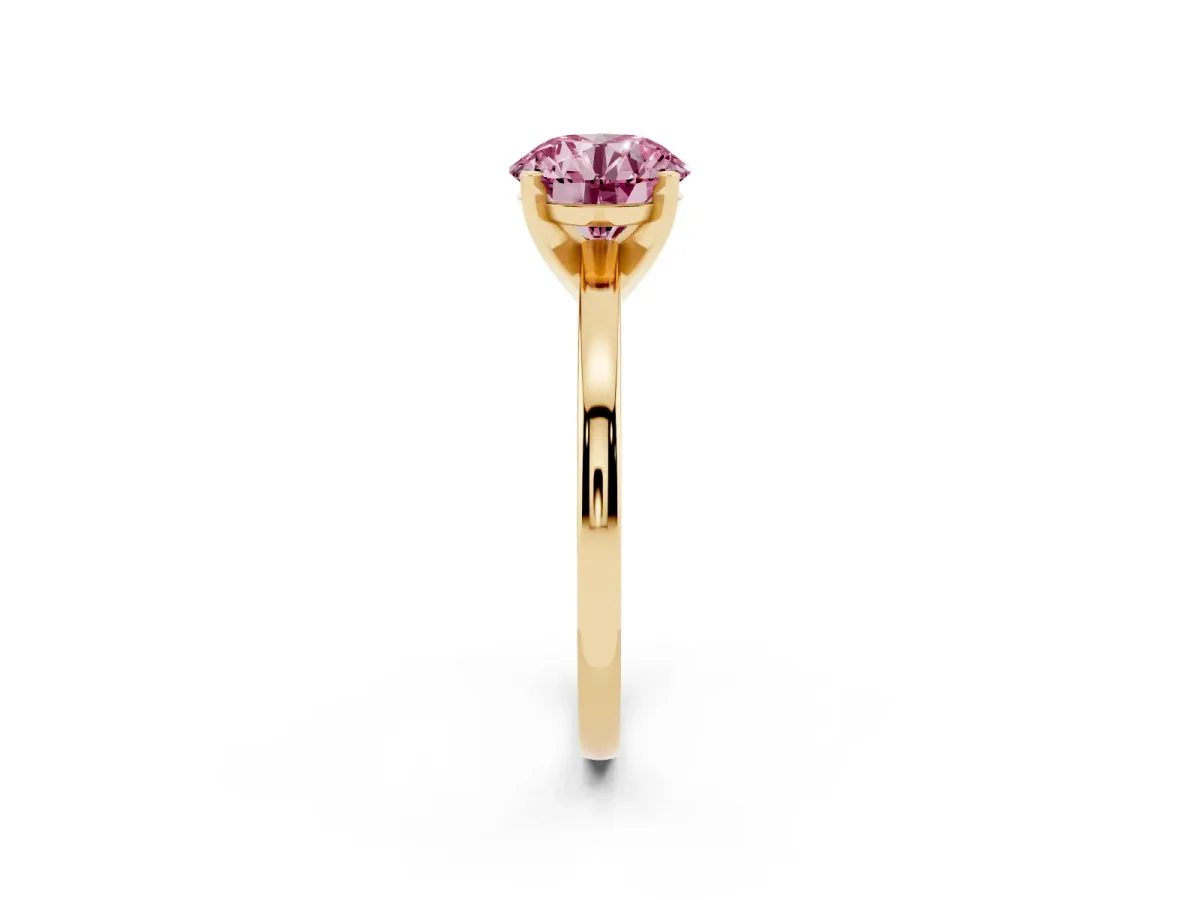Fancy Pink Round Cut Solitaire Diamond Engagement Ring with Four-Prong Setting on a Classic Band Yellow gold