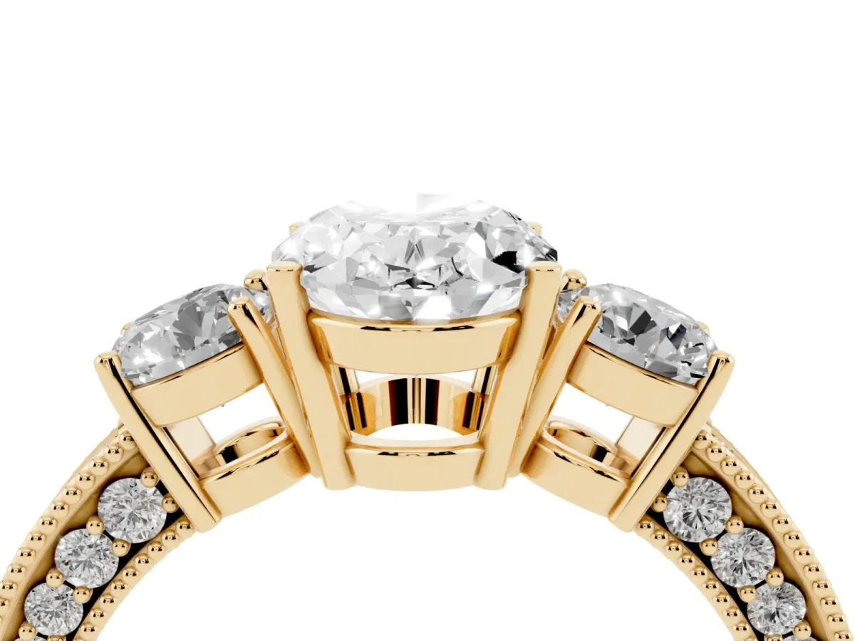 Oval Cut Three-Stone Diamond Ring with Pavé Band and Four-Prong Setting Yellow gold