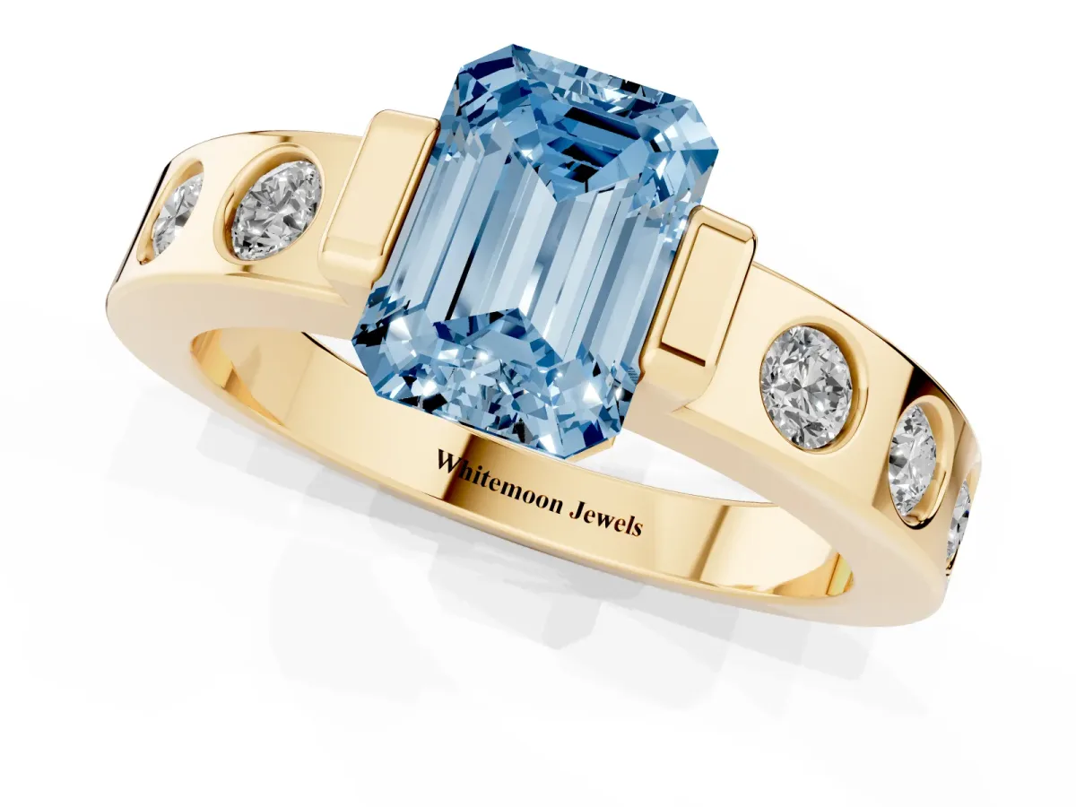 Fancy Blue Emerald Cut Brilliant Channel-Set Diamond Ring with Bezel Prong Setting Yellow gold