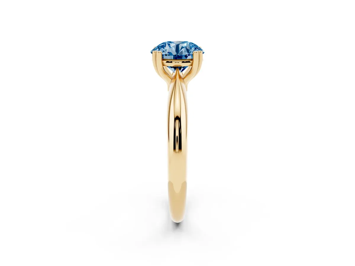 Fancy Blue Round Cut Cut Solitaire Engagement Ring with Tapered Band and Four-Prong Setting Yellow gold