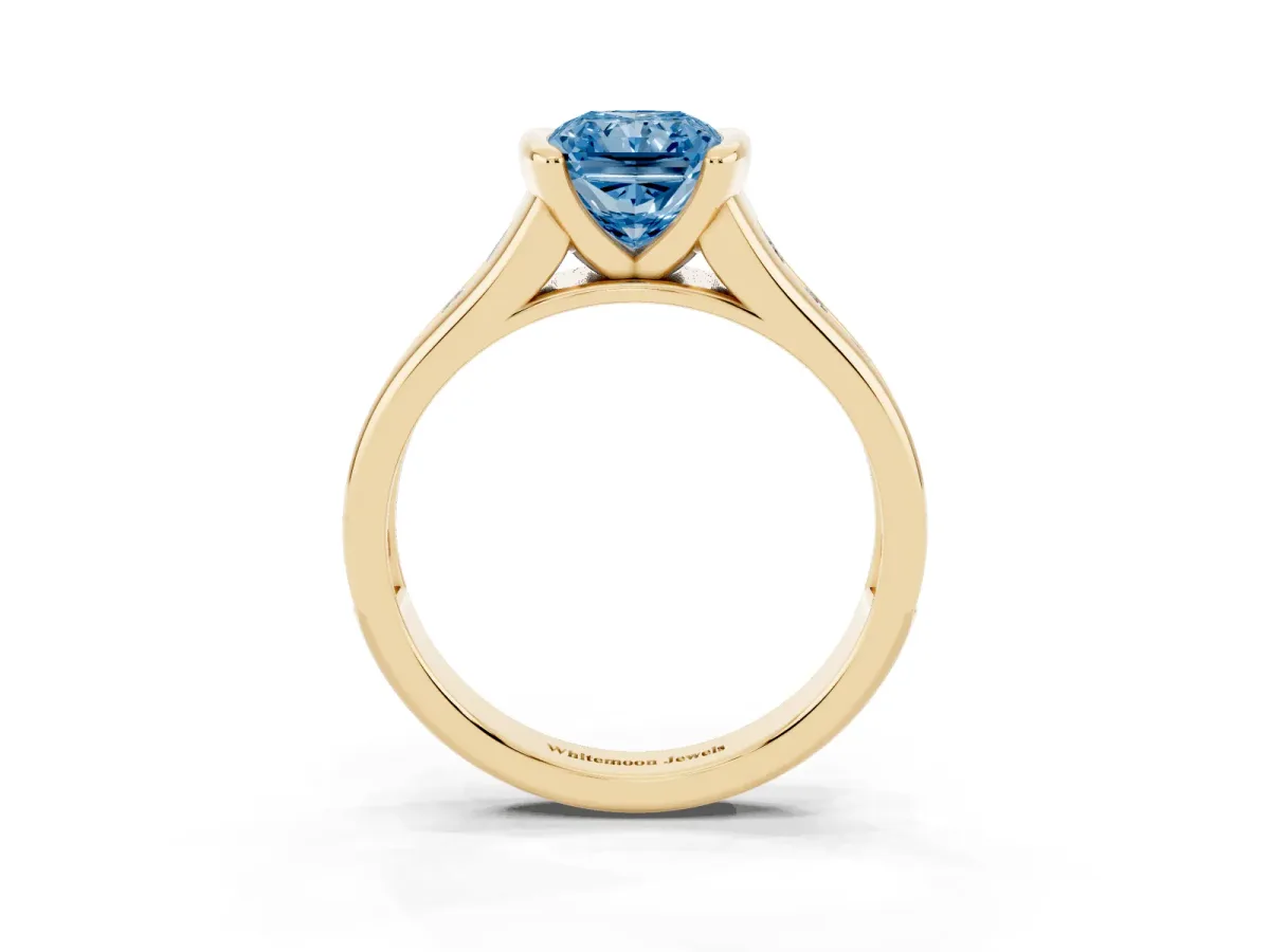 Fancy Blue Radiant Cut Solitaire Bezel-Set Diamond Ring with Channel-Set Band Yellow gold