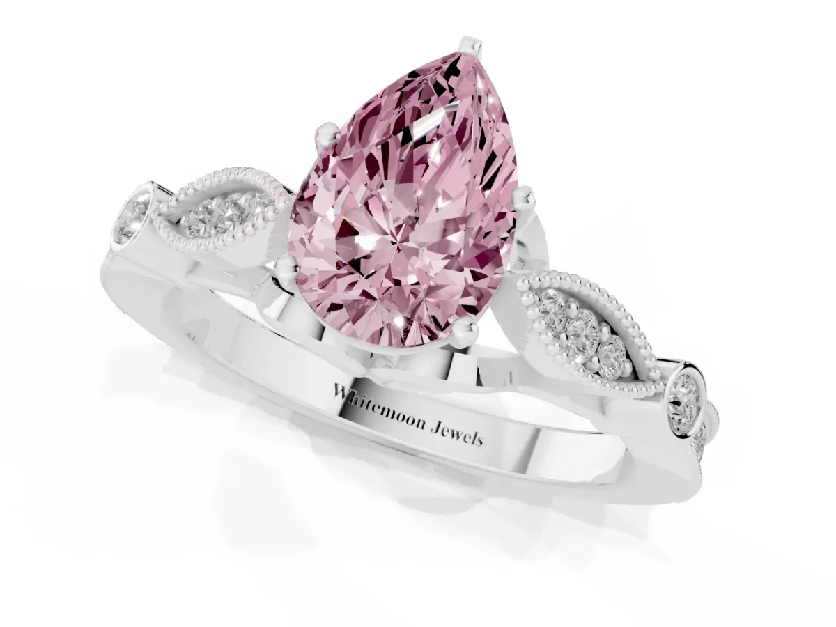 Fancy Pink Pear Cut Cut Diamond with Milgrain Marquise and Bezel Accents on a Solitaire Band with Prong Setting Platinum