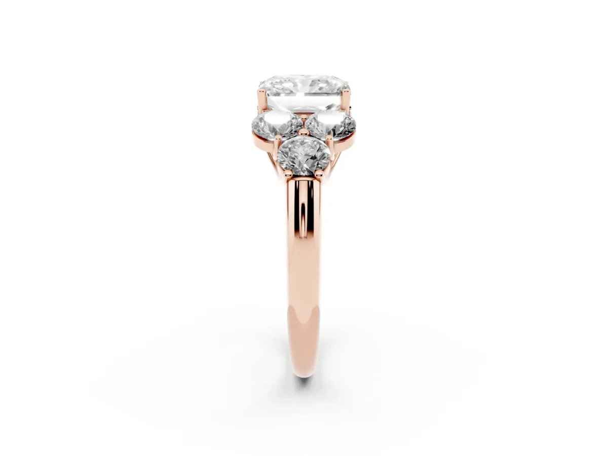 Radiant Cut Cut Diamond Cluster Ring with Round Accent Stones and Prong Setting on a Classic Band Rose gold
