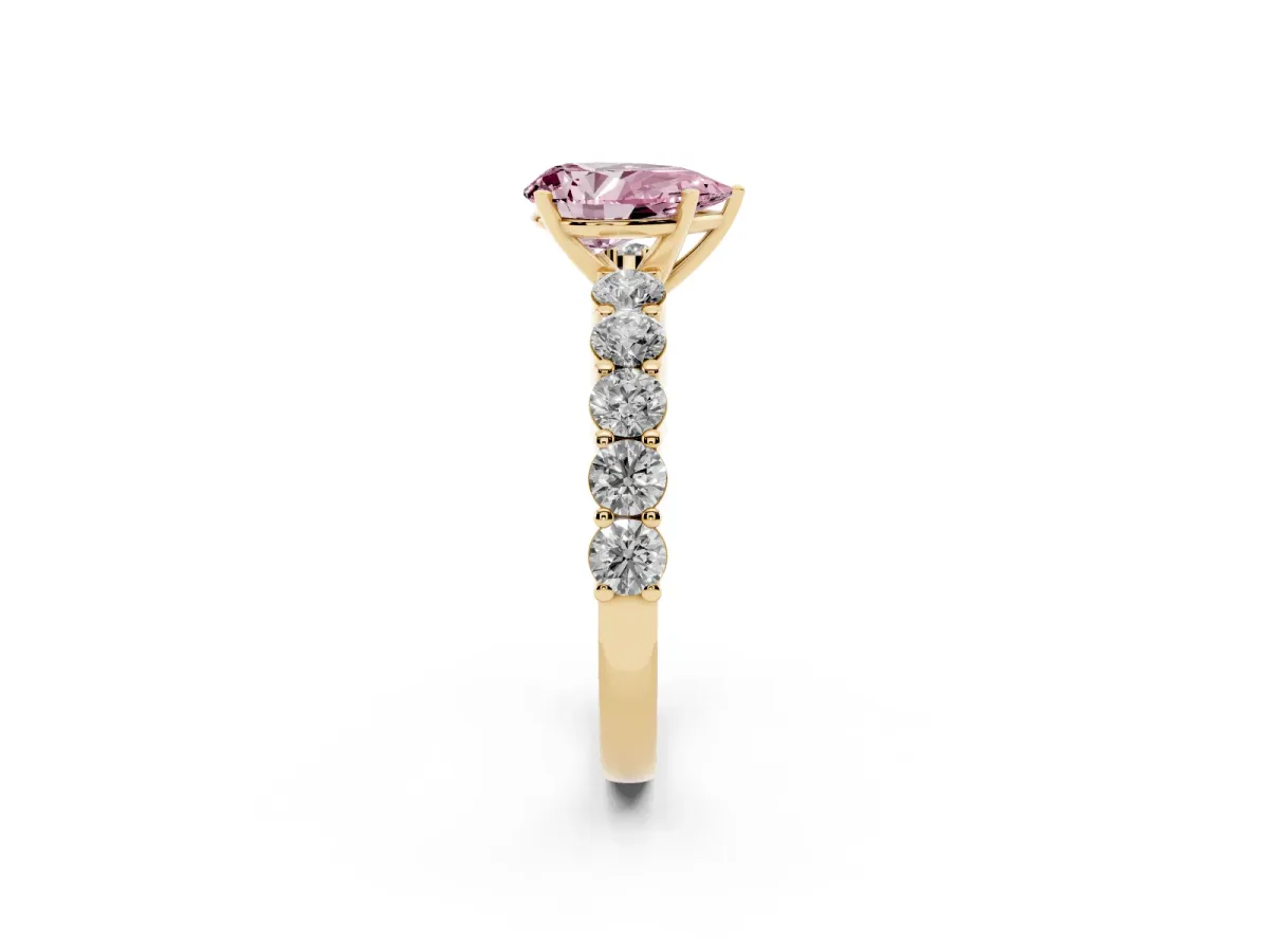 Fancy Pink Pear Cut Diamond Solitaire Ring with Shared Prong Round Side Stones Yellow gold